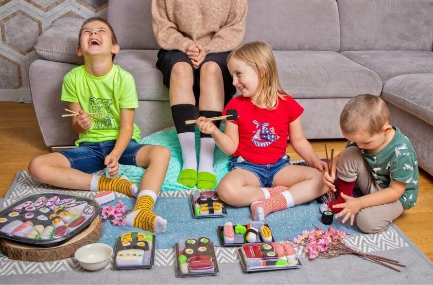Mum and children playing with sushi socks for kids
